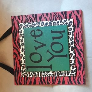 Sweet "love you" wall hanging sign. Fun colors & animal prints.